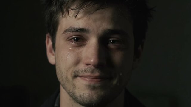 Young man crying directly into the camera while speaking with intense emotional expression.
