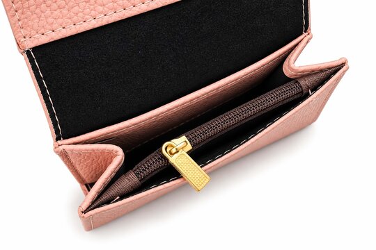 Open pink leather wallet with gold zipper and black interior lining