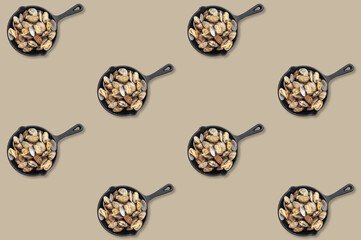 Black skillets filled with open clams repeated in diagonal rows across a pale beige decorative seafood background © Mironov