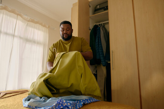 Man Folding Clothes chore