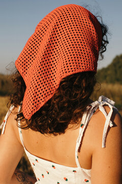 Anonymous woman in red headscarf