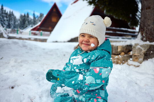 Happy child having fun at snow