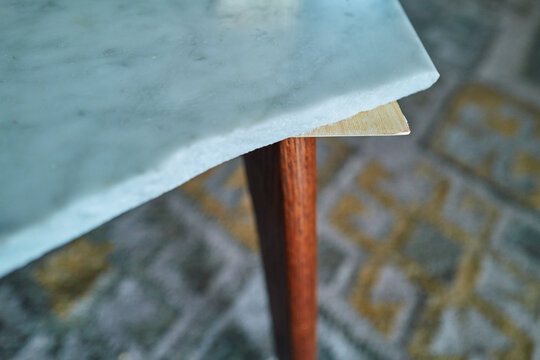 Chipped Corner of a Marble Coffee Table Showing Raw Edge