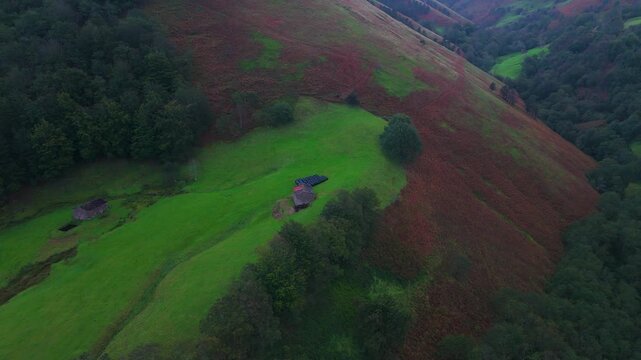 Aerial drone view of a winter landscape of hay meadows and forests in the Pisue&ntilde;a Valley. Los Valles Pasiegos region. Cantabria. Spain. Europe