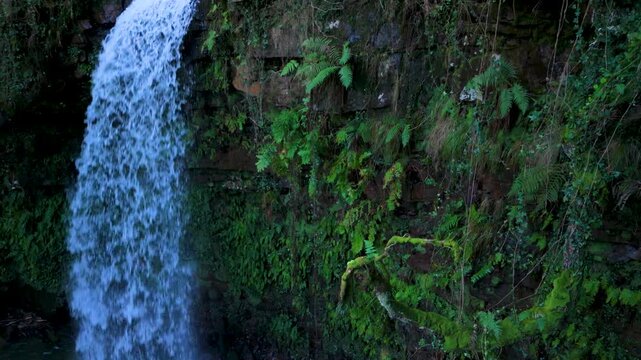 Aerial drone view of a winter landscape and waterfall near Selaya in the Pasiegos Valleys, Cantabria, Spain, Europe