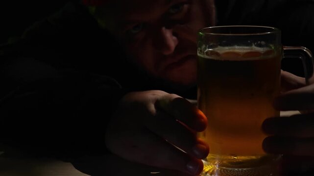 Man get drunk after drink new mug of beer.  