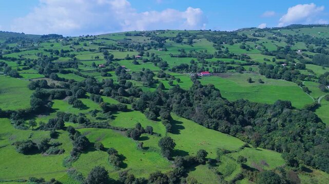 Aerial drone view of the landscape around Castillo Pedroso and the Churr&oacute;n de Borle&ntilde;a. Corvera de Toranzo. Pas Valley in the Pasiegos Valleys region. Cantabria. Spain. Europe