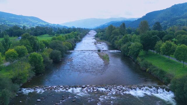 Aerial view from a drone of the Pas River in Corvera de Toranzo. Pas Valley in the Pasiegos Valleys region. Cantabria. Spain. Europe