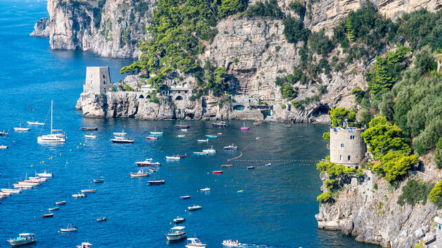 POSITANO, ITALY - SEPTEMBER 8, 2026: Scenic coastline view of Positano featuring Clavel Tower, Fornillo watchtower, boats moored in blue sea and Li Galli islands on the horizon, Amalfi Coast.