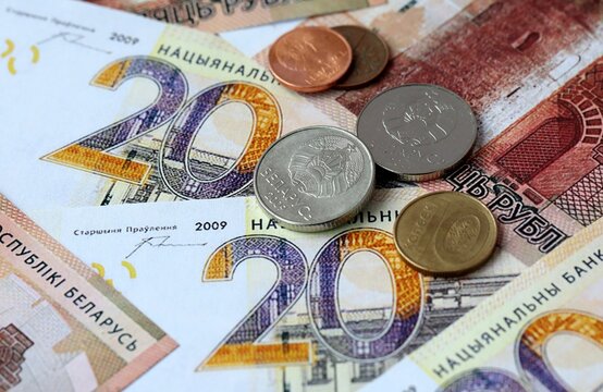 Belarusian ruble money banknotes and coins on table. Belarus cash bills of BYN currency