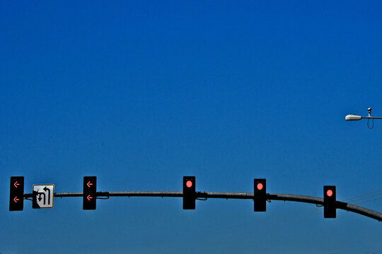 Five lane intersection with surveillance camera on light post