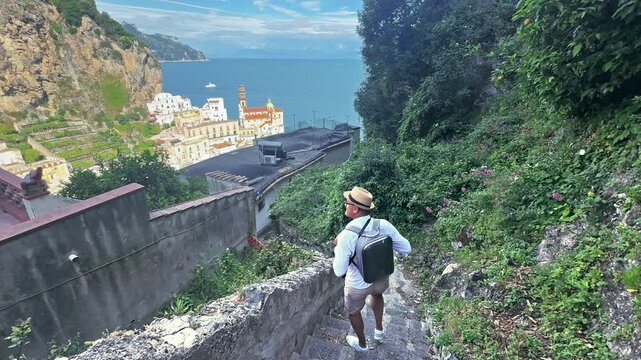 Tourist Man Enjoys Panoramic View of Atrani Amalfi Coast Italy