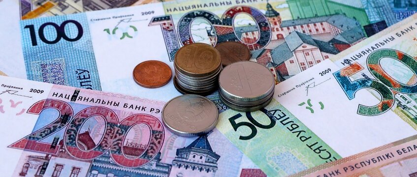 Belarusian ruble money notes and coins on table. Belarus cash bills of BYN currency close up