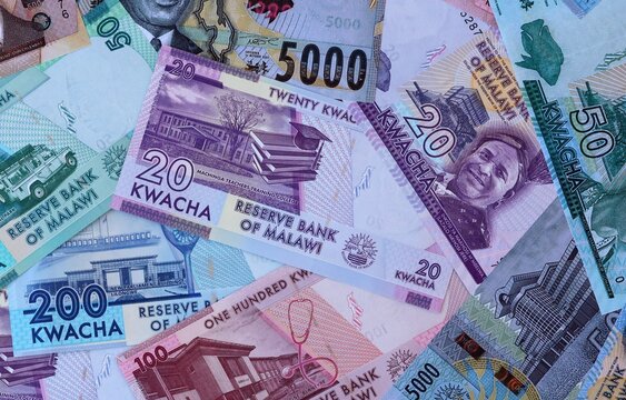 Big amount of Malawian kwacha money banknotes. Malawi cash bills of MWK currency close up