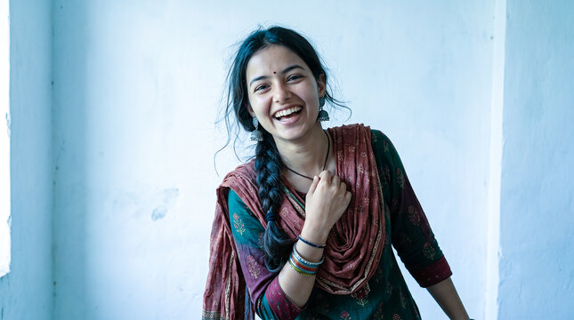 Portrait of Happy Young Indian Woman Laughing in Traditional Kurti and Dupatta