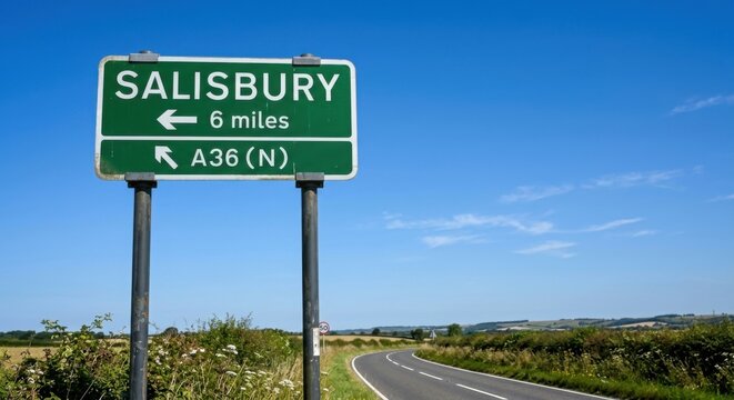Salisbury Road Sign 6 Miles to Destination on Sunny Day with Blue Sky