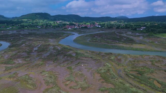 Aerial drone view of the marshes at low tide in Escalante in the Marismas de Santo&ntilde;a, Victoria y Joyel Natural Park. Cantabrian Sea. Santo&ntilde;a, Cantabria, Spain, Europe