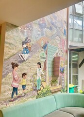 Beautiful Storybook Mural Featuring Family Characters And Whimsical Village Scenes © Ari Rusliyanto