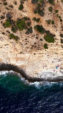 Top down Giola natural pool on the rocky coast, Thassos, vertical