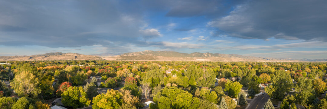 Fort Collins and foothills of Rocky Mountains in Colorado - aerial panorama of early fall morning scenery
