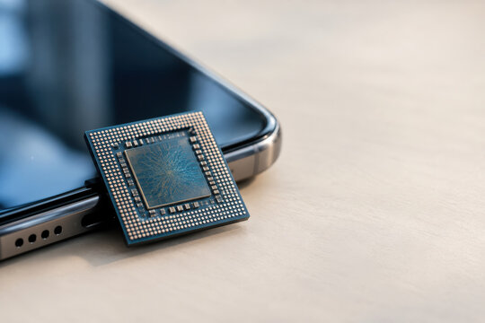 Neuromorphic microchip on smartphone edge close-up suggesting brain-inspired computing low-power Edge AI hardware for mobile innovation and energy-efficient processors