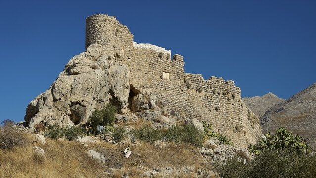 Kastro, Chrisocherias monastery, stone ruins of an old fortress on a rocky hill against a mountain backdrop, Pothia, main town, port, Kalymnos, Sponge Diving Island, Dodecanese, Greek Islands, Greece