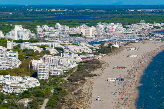 Aerial view of people swimming and relaxing on the beach in La Grande-Motte, H&eacute;rault, South of France
