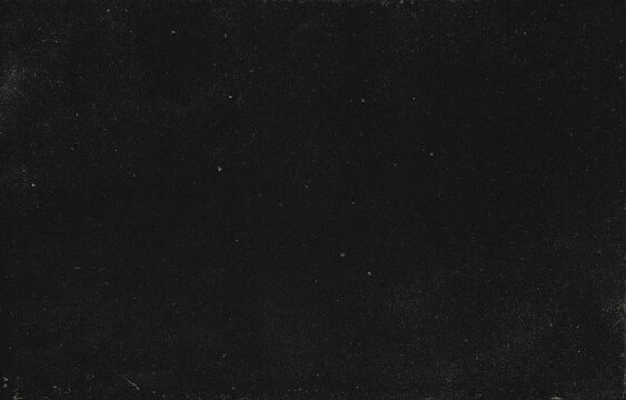 Film Grain Texture Overlay With Fine Dust, Scratches and Distressed Speckles on a Dark Black Background