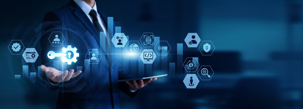 IT administrator holding tablet with glowing Access Management icon, identity control, user permissions, authentication, cybersecurity, secure login for future business growth and innovation.