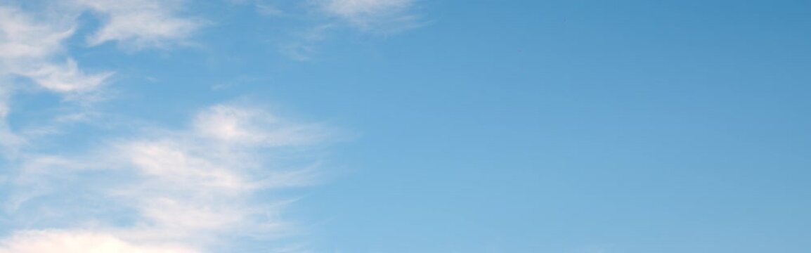 Anamorphic time-lapse of wispy autumn clouds moving across the sky