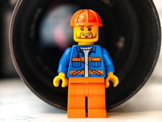 Naklejka premium Russia, St. Petersburg, August 8, 2020. Close-up of a Lego man, against the background of the lens