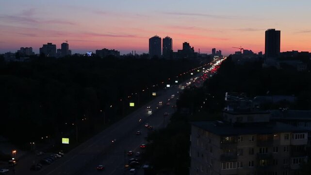 City highway traffic at sunset in Kyiv