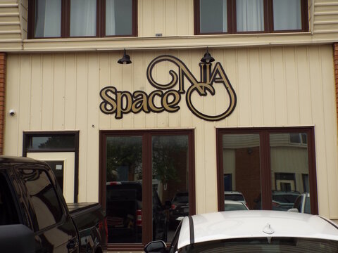 Gloucester, Ontario, Canada &ndash; July 31, 2026: A stylized sign reading "NIA Space" is mounted on the exterior wall of a commercial building above the entrance at 5480 Canotek Rd #14.