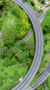 La Estampilla Viaduct with Traffic near Manizales, Colombia. Establishing Shot. Aerial View. Vertical Video.