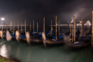 Gondolas along the pavementa and pier of San Marco in Venice © Anna Bogush