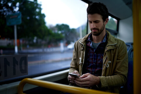 Reading, phone and travel with man on bus for location app, tracking journey and social media. Communication, public transportation and online metro update with person in vehicle for passenger trip