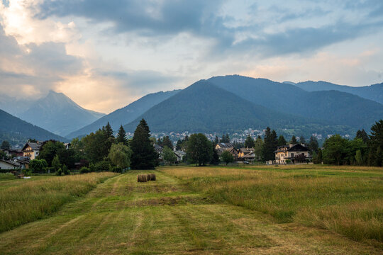Alpine meadow with hay bales in Santa Maria Maggiore, Vigezzo Valley