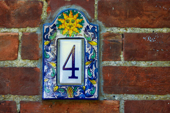 House number 4, tiles, brick wall