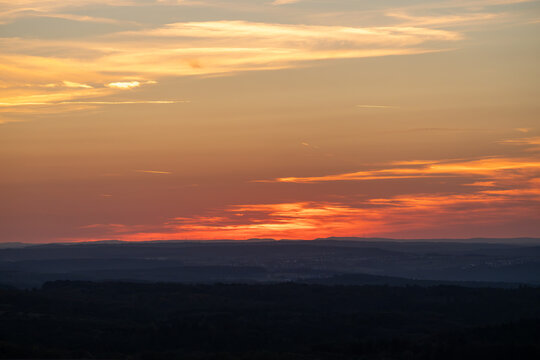 Vibrant Sunset Over Rolling Hills