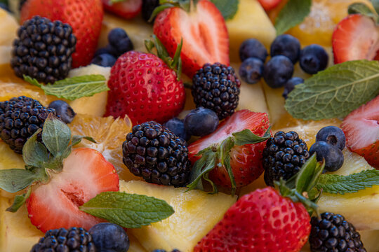 Close-up of fresh fruit and berries on plate