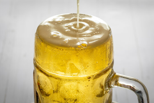 Draft beer filled in glass mug
