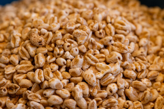 Close-up of puffed wheat grains background texture