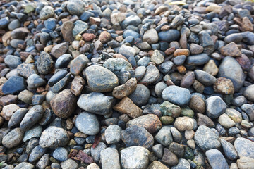 Pile of Smooth River Rocks and Pebbles in Various Colors and Sizes. © Jajar