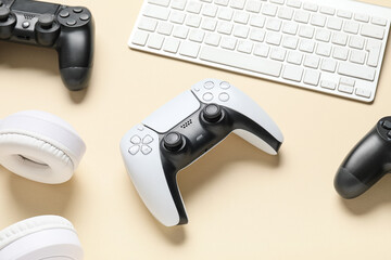 Gaming culture and entertainment, video game controllers with computer keyboard and headphones on a desk for digital leisure and interactive media © Pixel-Shot
