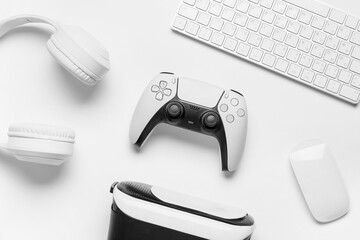 Gaming and entertainment technology, video game controller with vr headset and computer peripherals on a clean white background for digital lifestyle © Pixel-Shot
