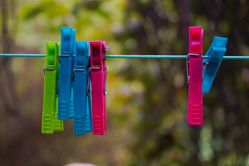 clothespins on a rope © Aigars
