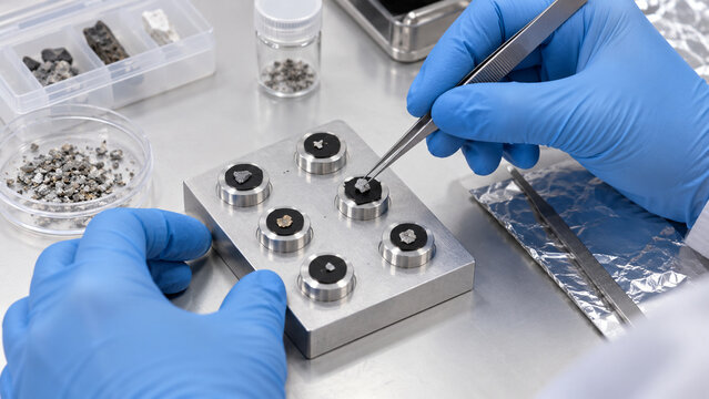 Scientist Mounting Samples on Electron Microscope Stubs