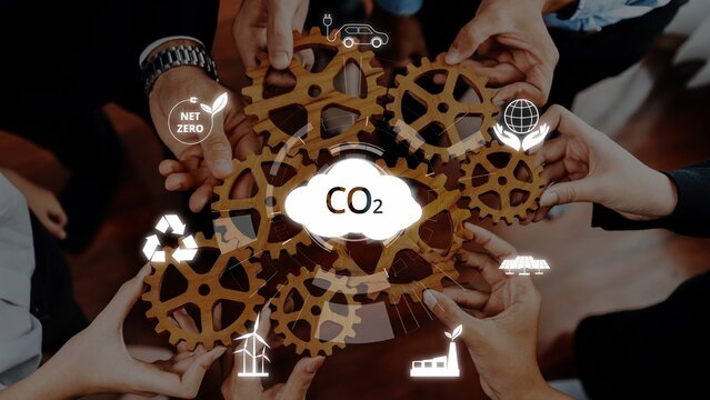 A dynamic representation of hands working together with gears, symbolizing collaboration towards achieving net zero CO2 emissions and promoting sustainable practices in various sectors. Raster