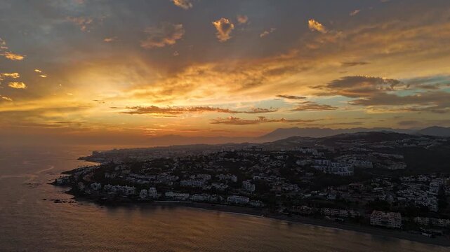 Hyperlapse Dramatic Sunset Aerial View of Mijas Coastal Bay and Headland, Costa del Sol, Malaga, Andalucia, SpainHyperlapse Dramatic Sunset Aerial View of Mijas Coastal Bay and Headland, Costa del Sol