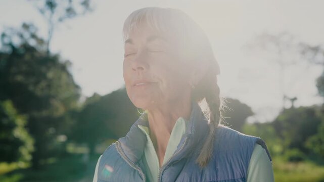 Thinking, smile and old woman in park with breathing, daydream and nostalgia in calm mindset. Retirement, flare and elderly person with fresh air, flashback and peaceful perspective in nature.